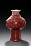 A RED GLAZED VASE