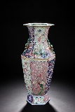 A LARGE CARVED FAMILLE ROSE HEXAGONAL VASE