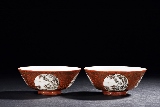 A PAIR OF FAMILLE ROSE CORAL RED GROUND MEDALLION BOWLS