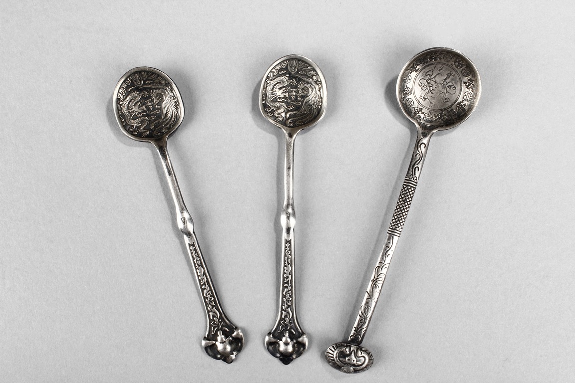A SET OF VINTAGE SILVER UTENSILS