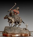 A CAST BRONZE STATUE OF COWBOY AND HIS HORSES