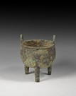 AN ARCHAIC BRONZE RITUAL TRIPOD FOOD VESSEL (DING)