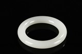 A WHITE JADE ROUND BANGLE