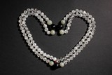A CRYSTAL AND GEMS NECKALCE CHAOZHU