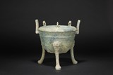 A ARCHAIC BRONZE TRIPOD RITUAL VESSEL
