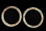 A PAIR OF SPIRAL JADE BANGLES