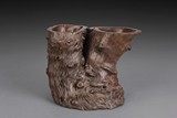 AN IRONWOOD ROOT DOUBLE BRUSH POT