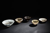 A SET OF FIVE CERAMIC BOWLS