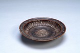 A BROWN GLAZED DISH