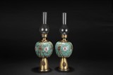 A PAIR OF BRONZE ENCASED FAMILLE ROSE OIL LAMPS