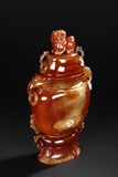 A RED AGATE VASE WITH COVER