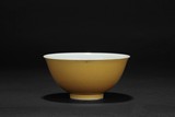 A SMALL YELLOW GLAZED BOWL