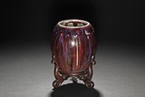 A FLAMBE-GLAZED JAR WITH STAND