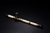 A SILVER AND BONE CARVED OPIUM PIPE