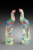 A PAIR OF FAMILLE ROSE FIGURES OF PHOENIX
