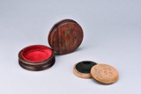 A YIXING DUAN-CLAY CIRCULAR INKSTONE