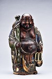 A PORCELAIN FIGURE OF BUDAI