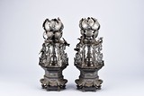 A PAIR OF TWO PEWTER 'DRAGON' CANDLESTICKS