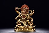 A GILT BRONZE FIGURE OF SIX-ARM MAHAKALA
