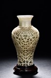 A VERY RARE WHITE JADE OPENWORK REVOLVING VASE