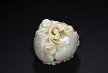 A WHITE JADE CARVED 'BOY AND LOTUS'