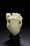A WHITE JADE 'CHILONG' ARCHASTIC WINE VESSEL