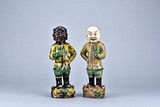 A SET OF TWO PORCELAIN 'HU BOY' FIGURES