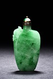 A JADEITE CARVED SNUFF BOTTLE