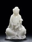 A WHITE JADE CARVED FIGURE OF GUANYIN