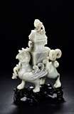 A LARGE CELADON JADE 'MYTHICAL BEAST' VASE AND COVER