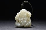 A WHITE JADE 'LUOHAN' CARVING