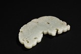 A WHITE JADE CARVED 'DRAGON' PENDANT