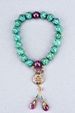 A TURQUOISE AND RUBY ROSARY BRACELET