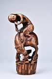 A BAMBOO CARVING OF BOY UPON BUFFALO