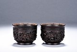 A PAIR OF SANDALWOOD 'DRAGON' WINE CUPS