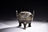 AN ARCHAISTIC BRONZE TRIPOD DING VESSEL 