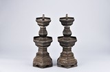 A PAIR OF BRONZE CANDLESTICKS