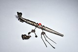 AN OPIUM SMOKING PIPE