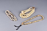 A SET OF THREE BONE BEADED NECKLACES 