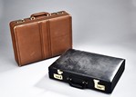 A SET OF TWO VINTAGE BRIEFCASES