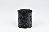 A BLACK JADE OR STONE COVERED BRUSHPOT