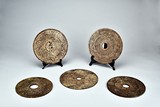 A SET OF FIVE ARCHAIC JADE DISCS 