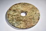 AN ARCHAIC CIRCULAR JADE DISC