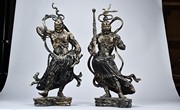 A PAIR OF PARCEL GILT BRONZE CAST GUARDIAN FIGURES