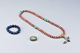 A GROUP OF LAPIS LAZULI, CORAL, AND JADEITE JEWELRY