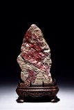 A CHICKEN BLOOD SOAPSTONE BOULDER