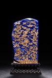 A GILT-PAINTED LAPIS LAZULI BOULDER WITH ZITAN STAND