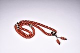 A CARNELIAN AND 'TIGER'S TEETH' DZI BEAD NECKLACE