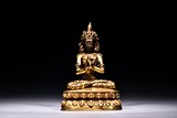A GILT BRONZE FIGURE OF SEATED BODHISATTVA