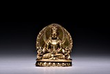 A SMALL GILT BRONZE FIGURE OF AMITABHA
